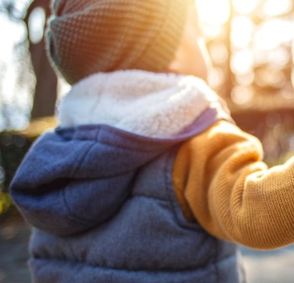 Boy in front of sunset